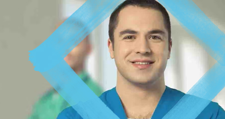 1. A man wearing a blue shirt smiles warmly at the camera, conveying a sense of happiness and friendliness.