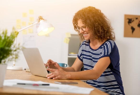 An MBA student studying online through a laptop.
