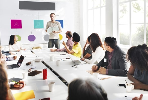 Business leaders in a meeting in a conference room.