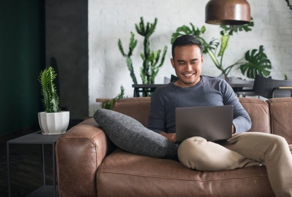 An MBA student studying online through his laptop remotely.