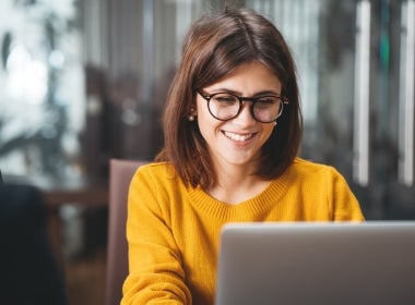 VU Online mental health student studying on their laptop.