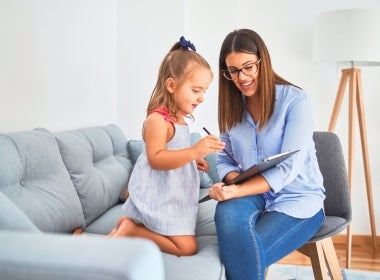 A child and adolescent mental health specialist working with a patient.