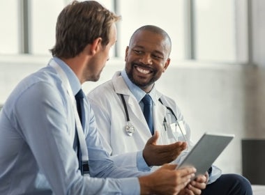 Two public health experts conversing with each other.