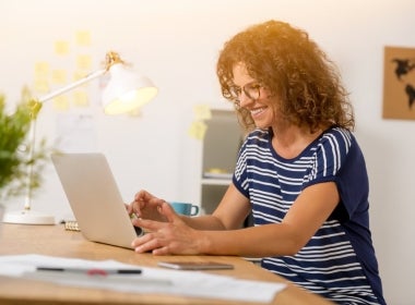 An MBA student studying online through a laptop.