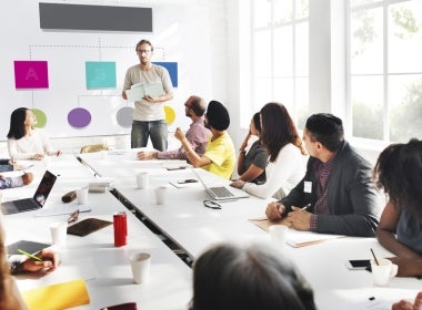 Business leaders in a meeting in a conference room.