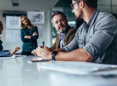 A group of coworkers in a discussion.